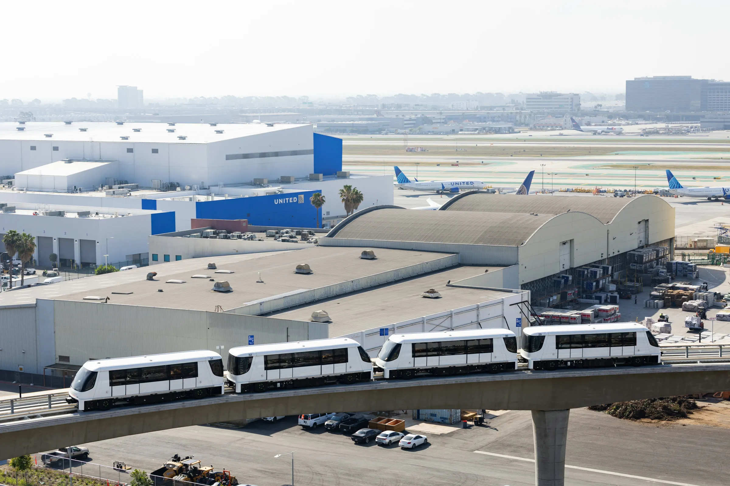 Aerial view of an international airport with its automated transit link