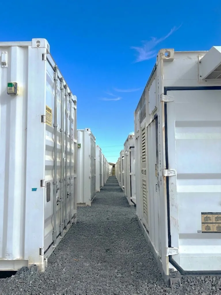 Row of containerized SCiB battery energy storage units at a renewable generation site